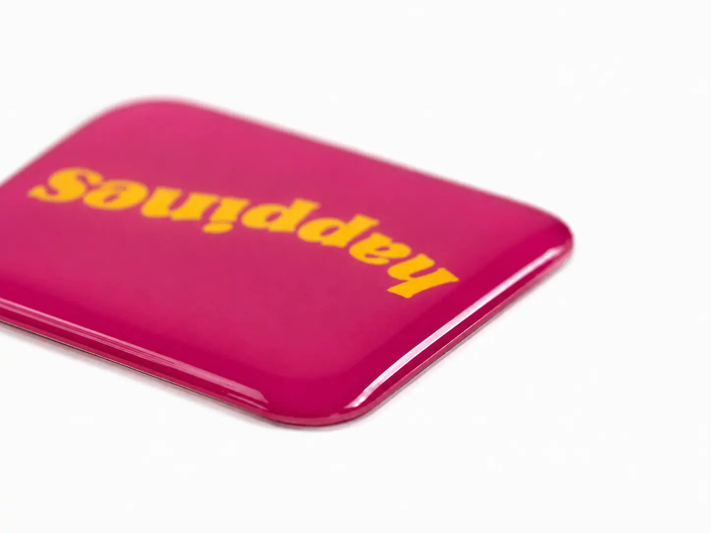 Clear resin doming applications including raised labels, 3D stickers, badges and dimensional emblems